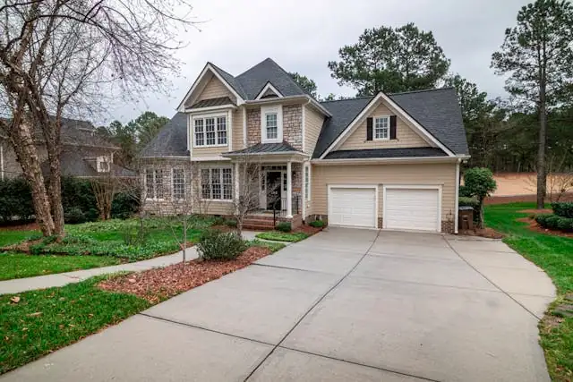 Suburban home with new shingle roof